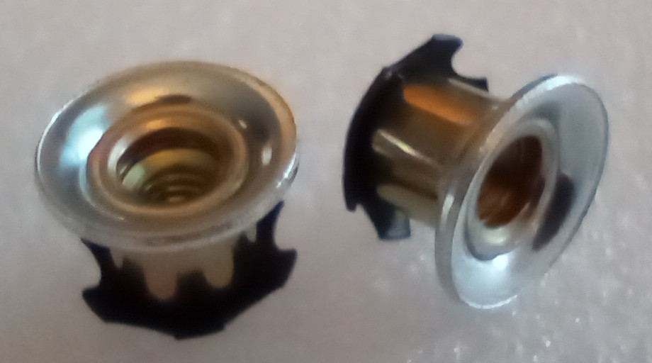 Two threaded inserts for 1/2in EMT conduit.